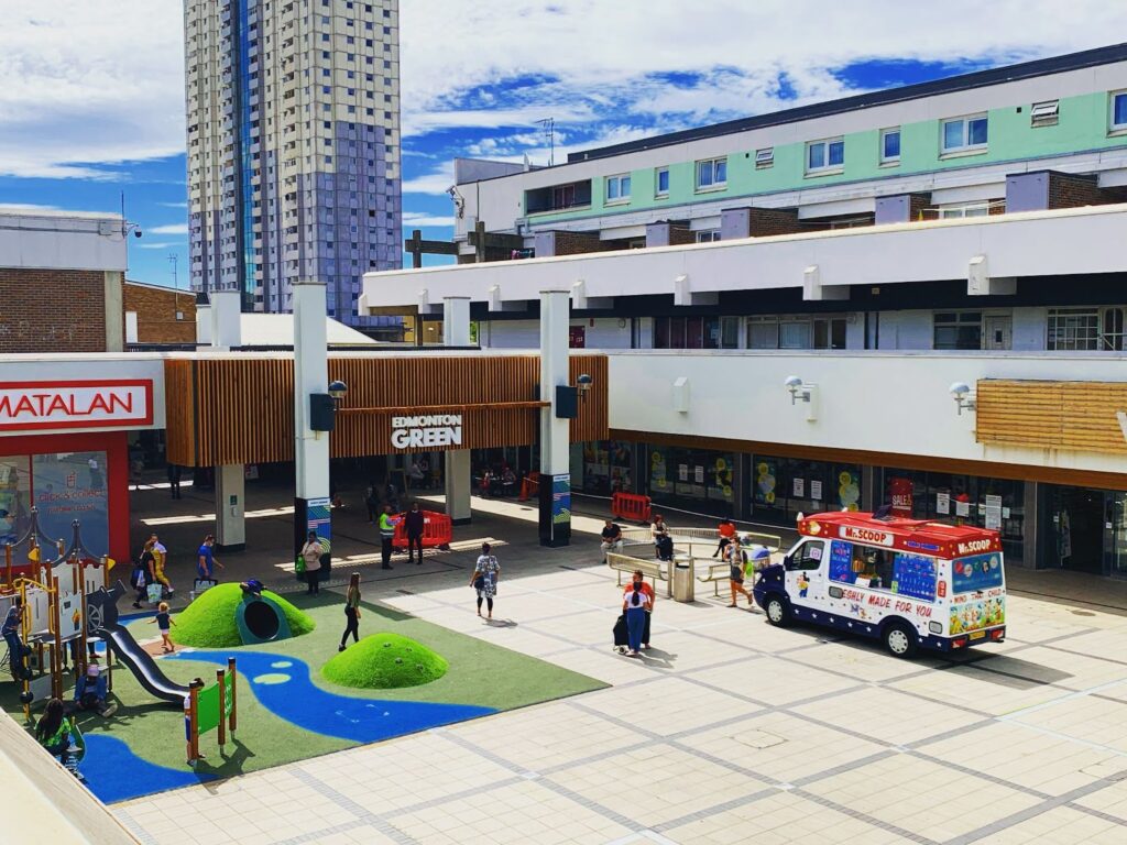 What To Do in May Half Term at Edmonton Green. This image is the outdoor space at North Square which shows a childrens play park at Edmonton Green Shopping Centre